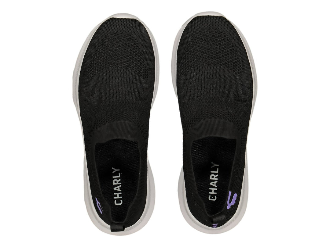Tenis deportivos Charly color negro con suela blanca, diseño slip-on sin agujetas.