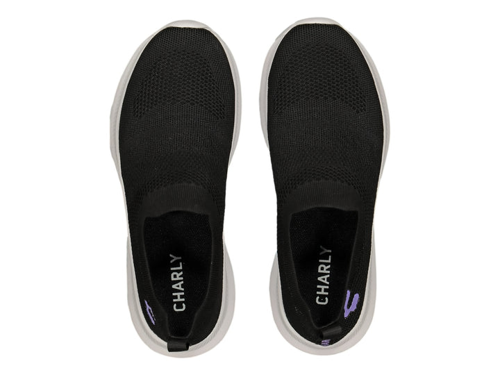 Tenis deportivos Charly color negro con suela blanca, diseño slip-on sin agujetas.