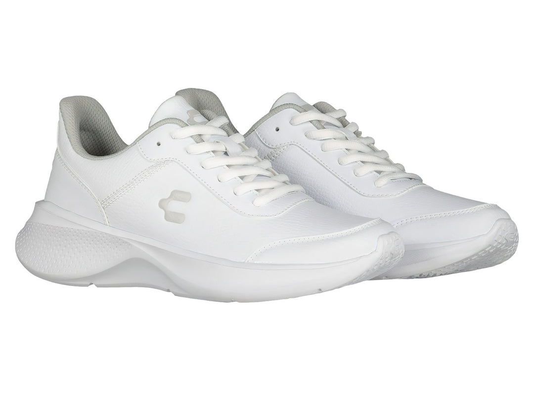 Par de tenis deportivos Charly color blanco con detalles en gris y suela blanca.