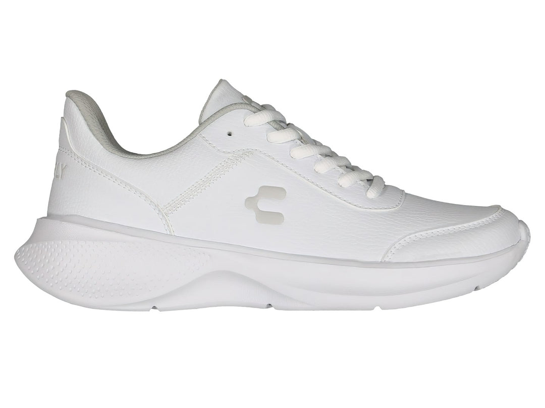 Par de tenis deportivos Charly color blanco con detalles en gris y suela blanca.