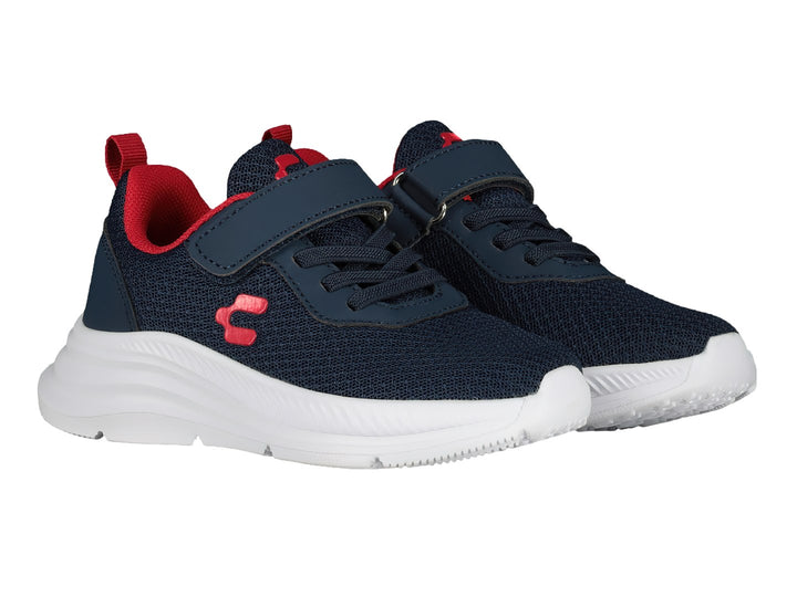 Tenis deportivos Charly color azul marino con suela blanca y detalles en rojo.