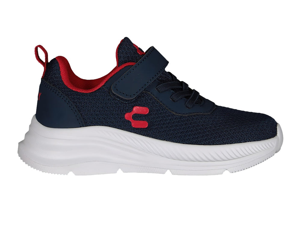 Tenis deportivos Charly color azul marino con suela blanca y detalles en rojo.