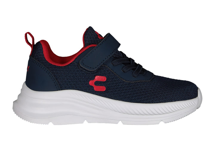 Tenis deportivos Charly color azul marino con suela blanca y detalles en rojo.