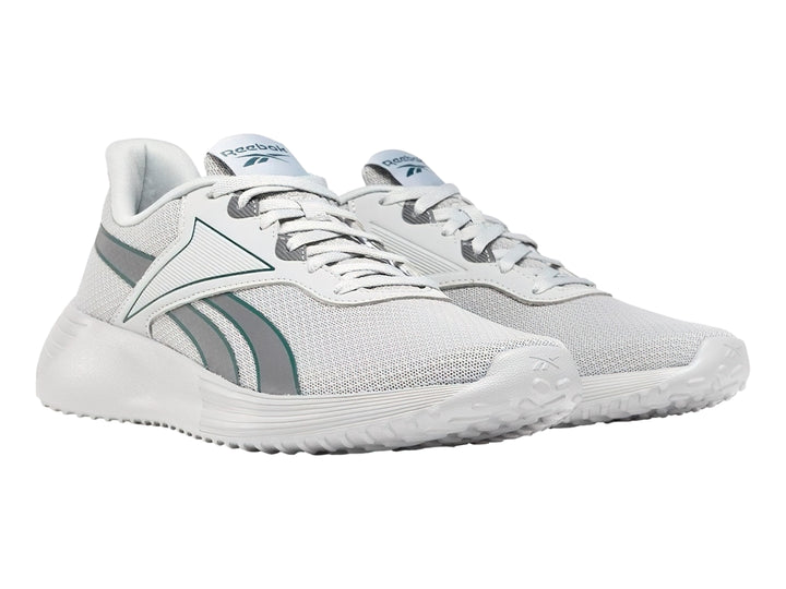 Tenis deportivos Reebok color gris con suela blanca y detalles en azul.