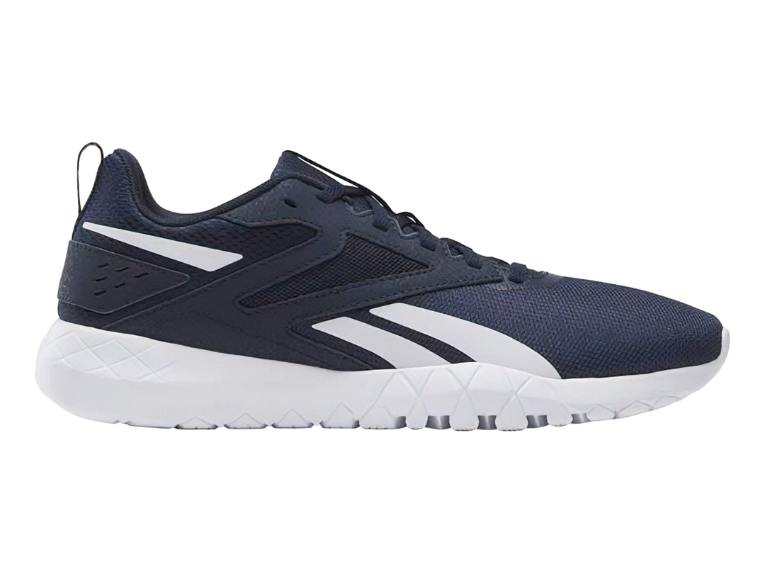 Tenis deportivos Reebok color azul marino con detalles y suela blanca.