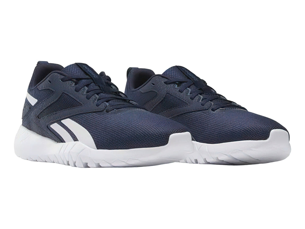Tenis deportivos Reebok color azul marino con detalles y suela blanca.