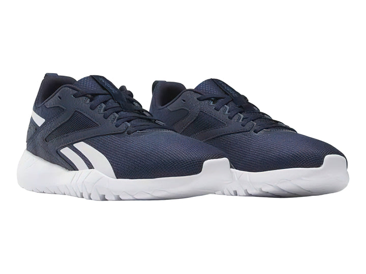 Tenis deportivos Reebok color azul marino con detalles y suela blanca.