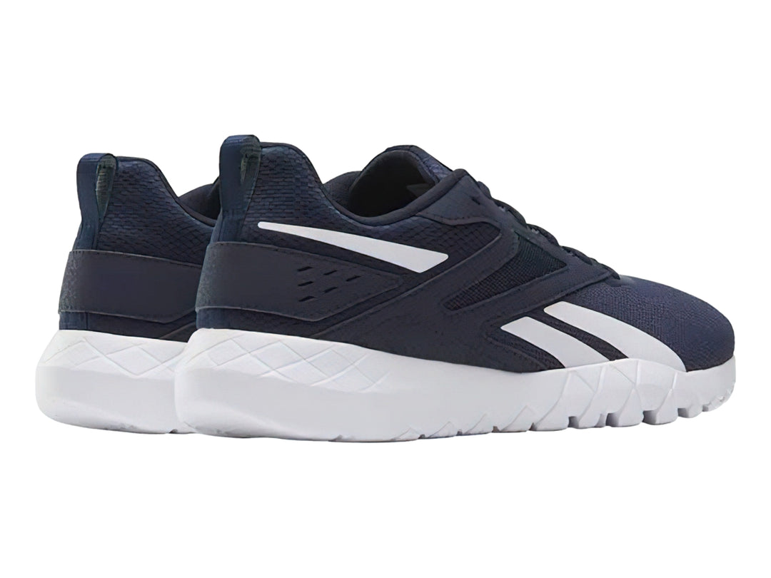 Tenis deportivos Reebok color azul marino con detalles y suela blanca.