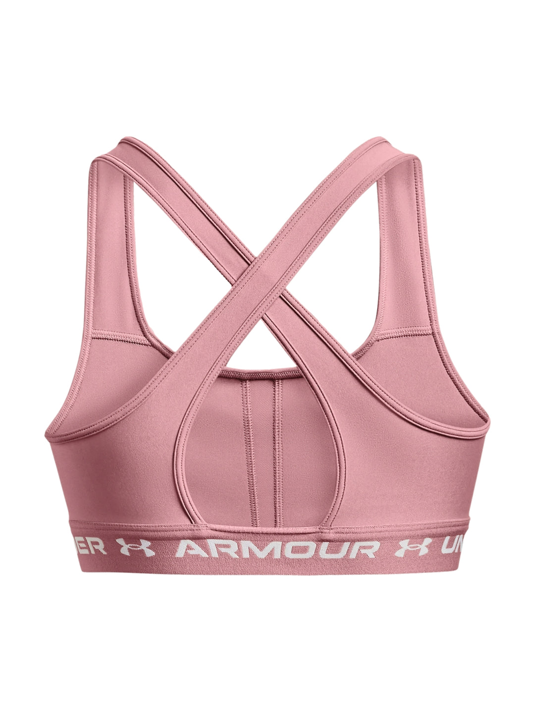 Mujer usando un bra deportivo color rosa de la marca Under Armour.