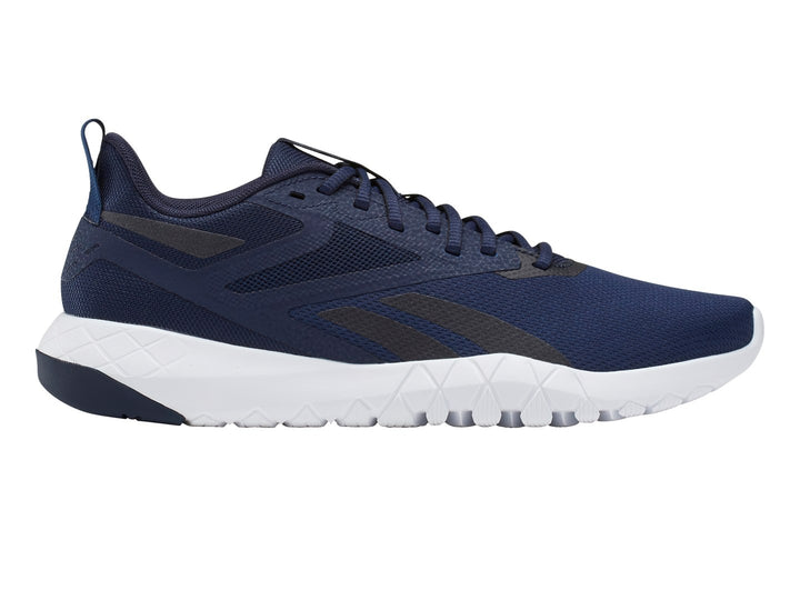 Tenis deportivos Reebok color azul marino con suela blanca y detalles en negro.