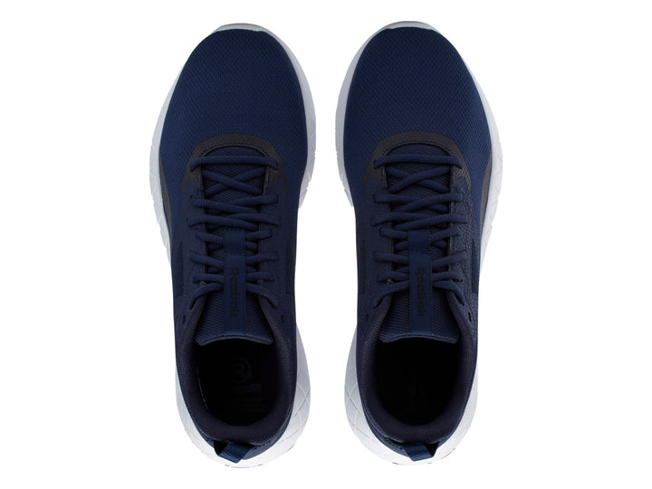 Tenis deportivos Reebok color azul marino con suela blanca y detalles en negro.