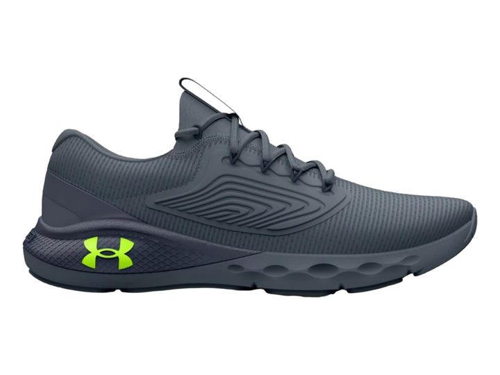 Tenis deportivos Under Armour color gris con logotipo en verde neón, vista lateral.