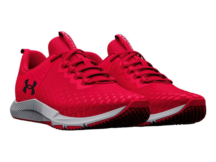 Tenis deportivos Under Armour color rojo con suela blanca y gris.