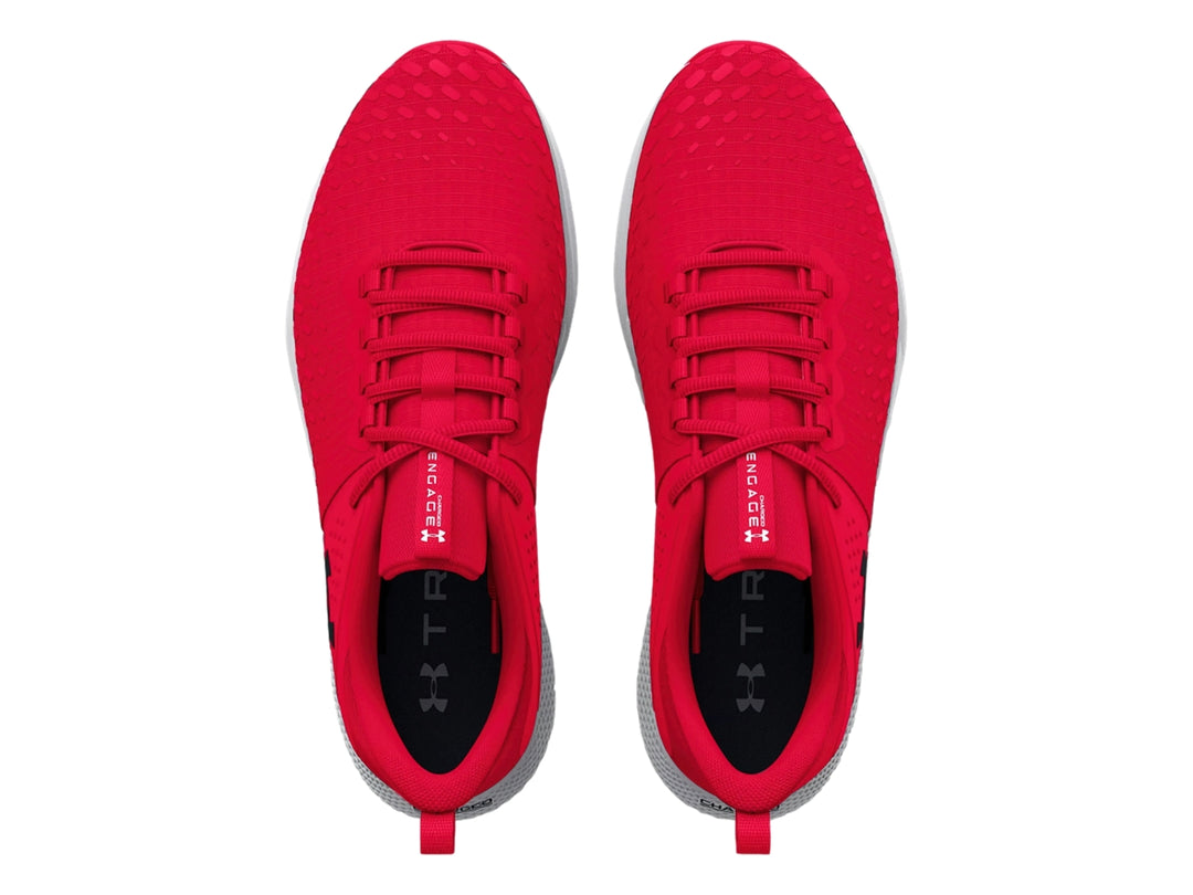 Tenis deportivos Under Armour color rojo con suela blanca y gris.