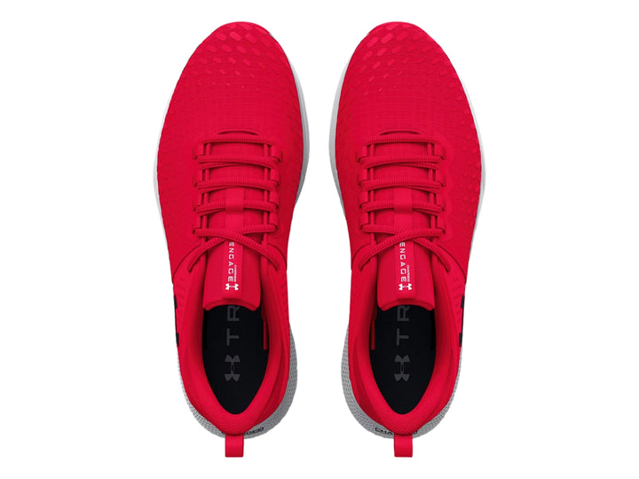 Tenis deportivos Under Armour color rojo con suela blanca y gris.