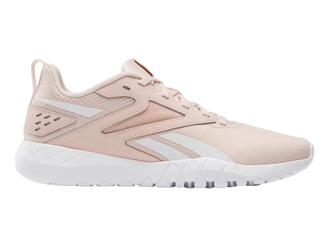 Tenis deportivos Reebok Flexagon Energy TR 4 color rosa con suela blanca.