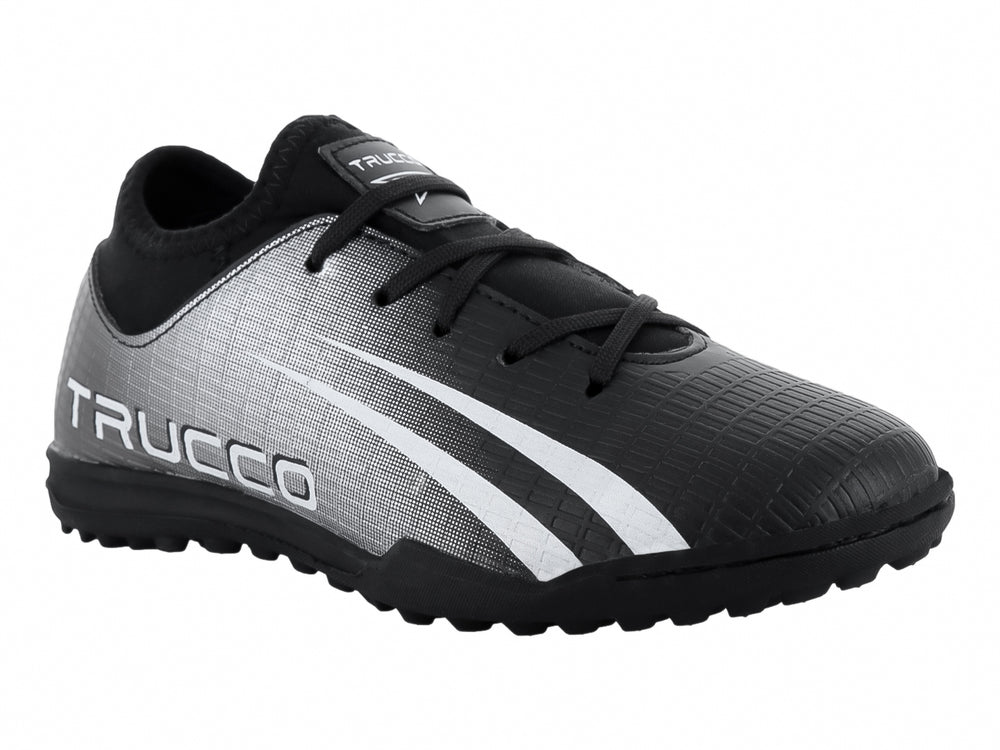 Zapato de fútbol Leon Trucco en color negro y blanco con suela para pasto sintético.