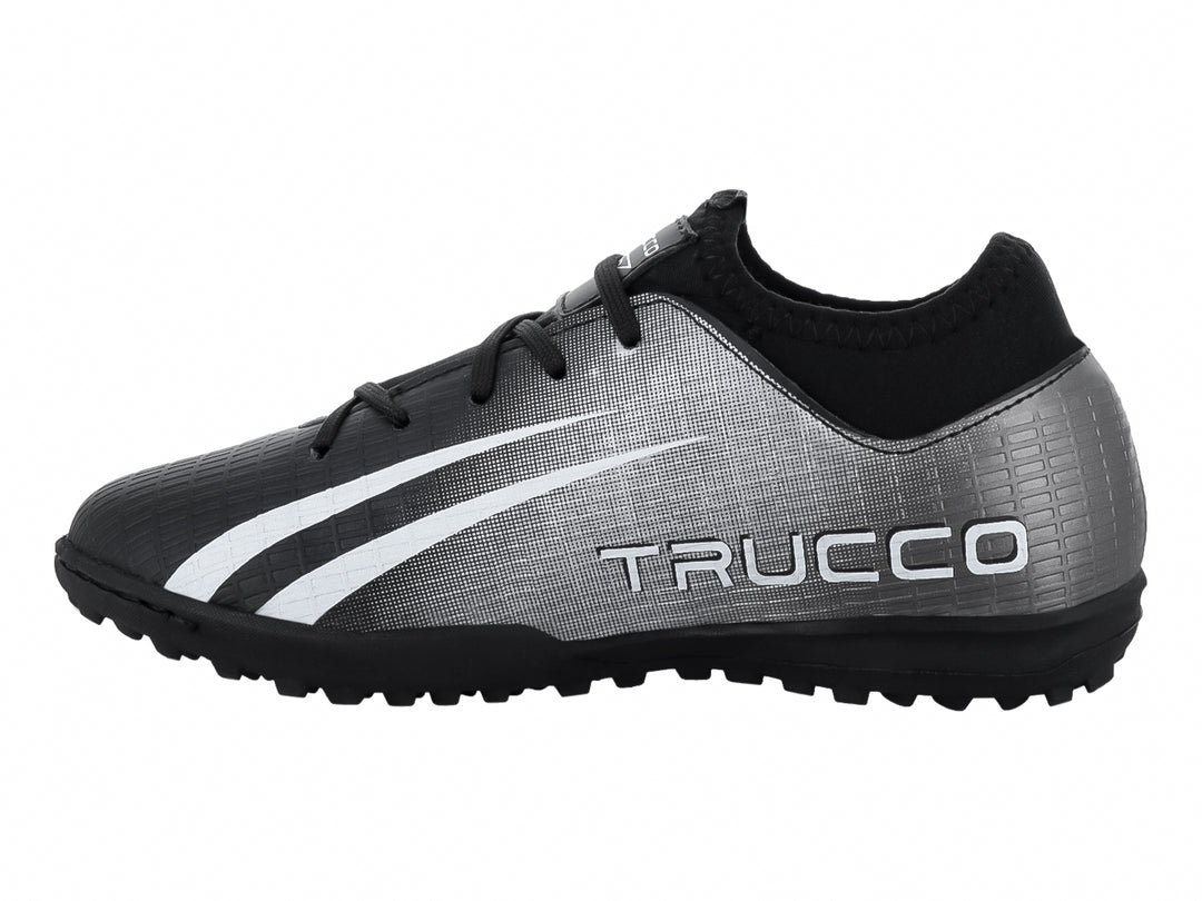 Zapato de fútbol Leon Trucco en color negro y blanco con suela para pasto sintético.