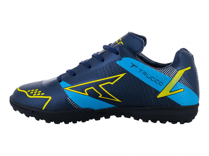 Zapato de fútbol Leon Trucco color marino con detalles amarillos y azules, ideal para canchas sintéticas.