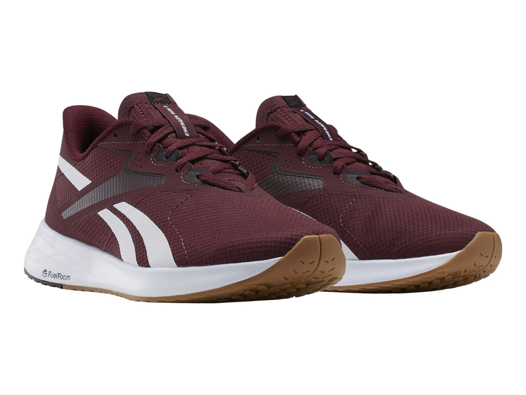 Tenis deportivos Reebok Energen Run 3 en color guinda con detalles en blanco y negro y suela blanca.