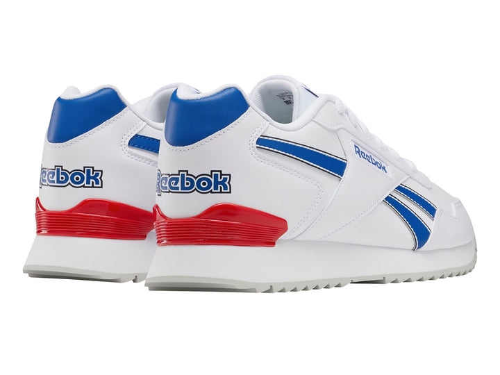 Tenis Reebok Glide Ripple Clip blancos con franjas azules y detalle rojo en el talón.