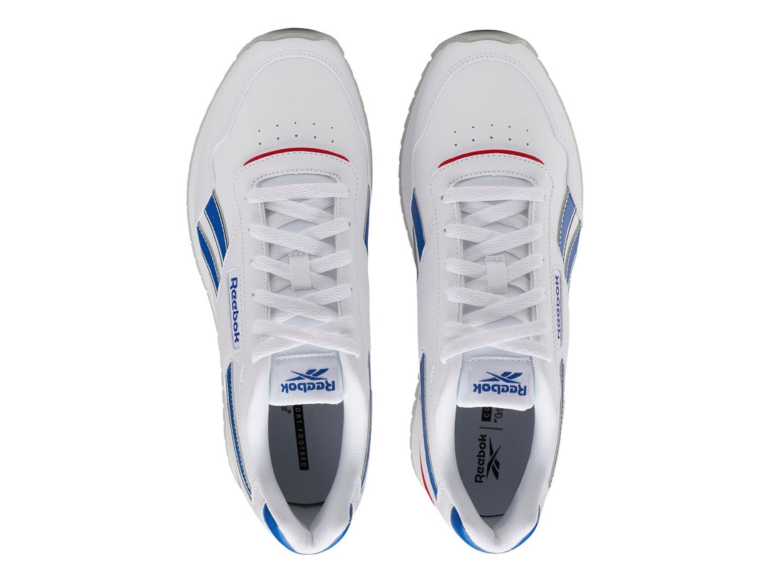 Tenis Reebok Glide Ripple Clip blancos con franjas azules y detalle rojo en el talón.