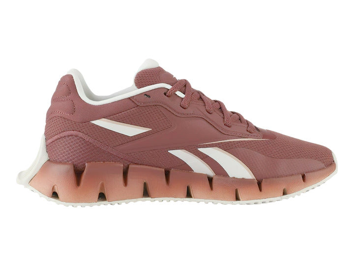 Tenis deportivos Reebok Zig Dynamica 4 en color rosa Sedona Rose con detalles blancos y suela amortiguada.
