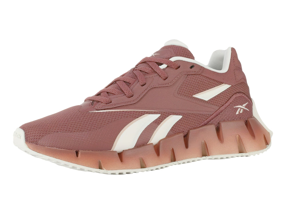 Tenis deportivos Reebok Zig Dynamica 4 en color rosa Sedona Rose con detalles blancos y suela amortiguada.