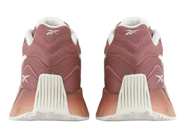 Tenis deportivos Reebok Zig Dynamica 4 en color rosa Sedona Rose con detalles blancos y suela amortiguada.