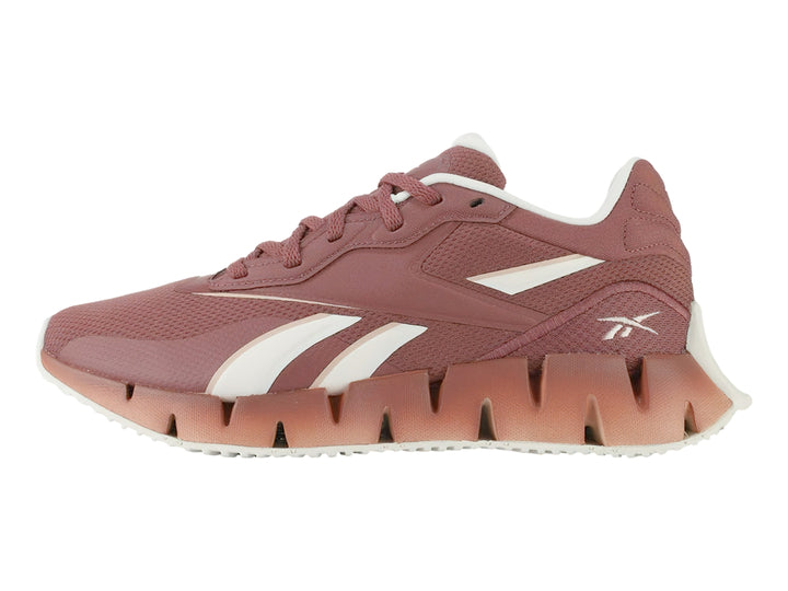 Tenis deportivos Reebok Zig Dynamica 4 en color rosa Sedona Rose con detalles blancos y suela amortiguada.
