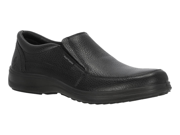 Zapato slip-on de cuero color negro marca Hush Puppies.
