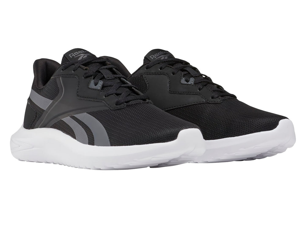 Tenis deportivos Reebok color negro con franjas grises y suela blanca.