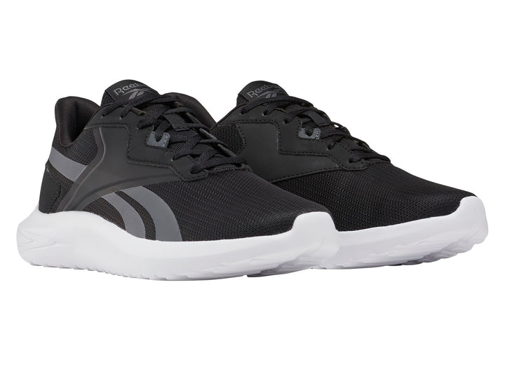 Tenis deportivos Reebok color negro con franjas grises y suela blanca.