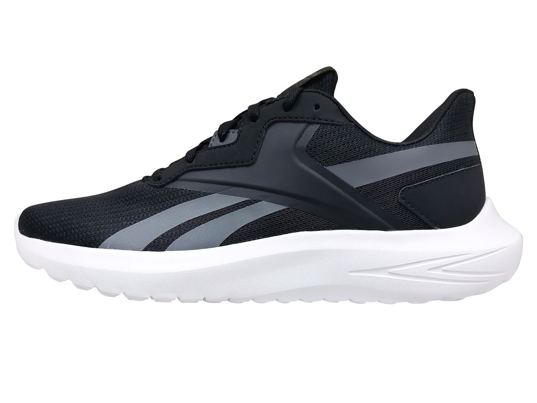 Tenis deportivos Reebok color negro con franjas grises y suela blanca.