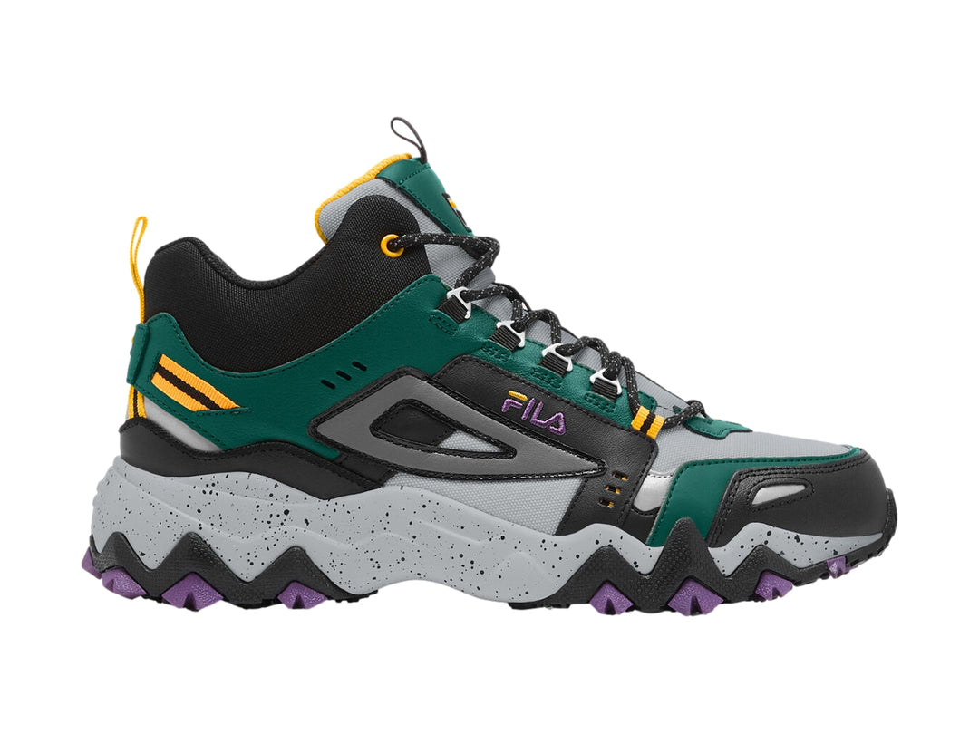 Tenis FILA Oakmont TR Mid en colores verde, negro y gris con suela robusta púrpura y detalles dorados.