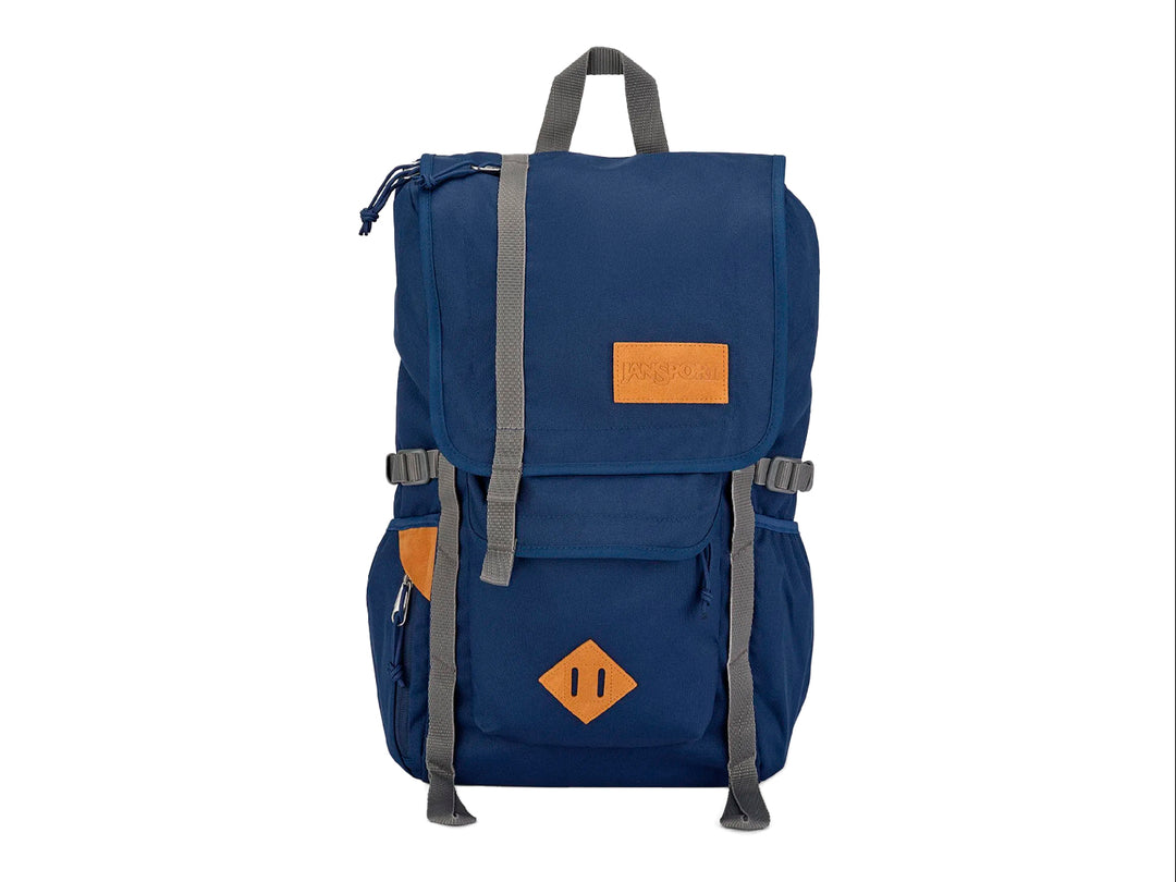 Mochila JanSport modelo Hatchet en color azul navy con correas grises y detalles en cuero marrón.