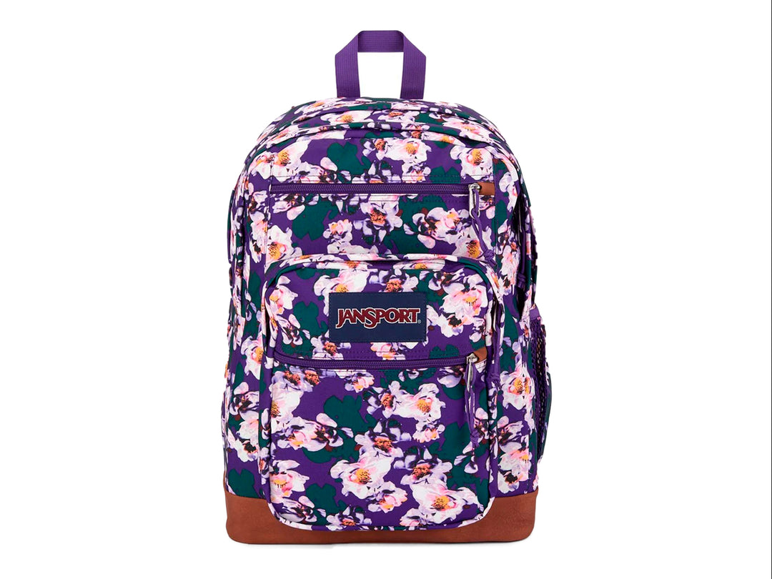 Mochila escolar JanSport con estampado de flores en tonos morado, blanco y rosa con base color marrón.
