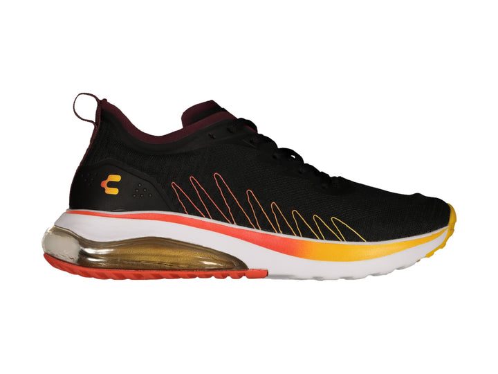 Tenis deportivos Charly color negro con suela degradada en naranja y amarillo y cámara de aire.
