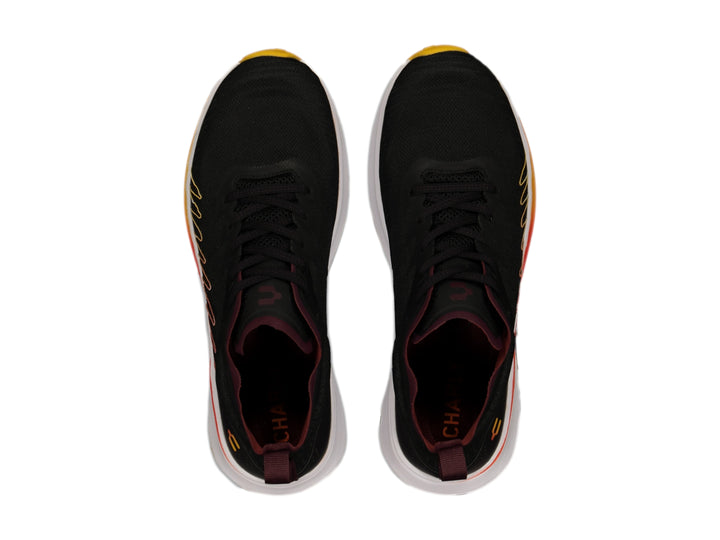 Tenis deportivos Charly color negro con suela degradada en naranja y amarillo y cámara de aire.