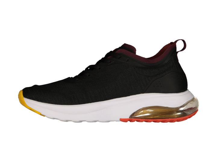 Tenis deportivos Charly color negro con suela degradada en naranja y amarillo y cámara de aire.