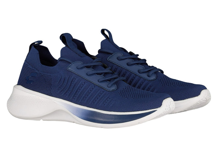 Par de tenis deportivos Charly en color azul marino con suela blanca y tejido transpirable.