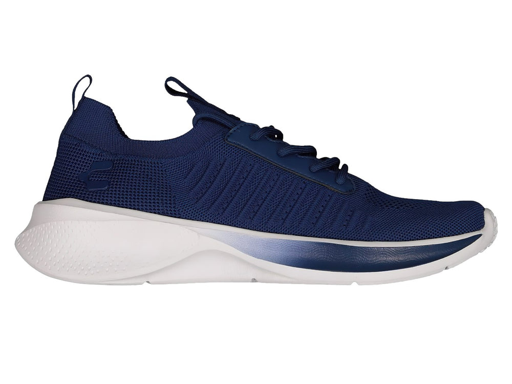 Par de tenis deportivos Charly en color azul marino con suela blanca y tejido transpirable.