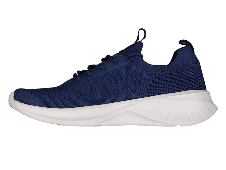 Par de tenis deportivos Charly en color azul marino con suela blanca y tejido transpirable.