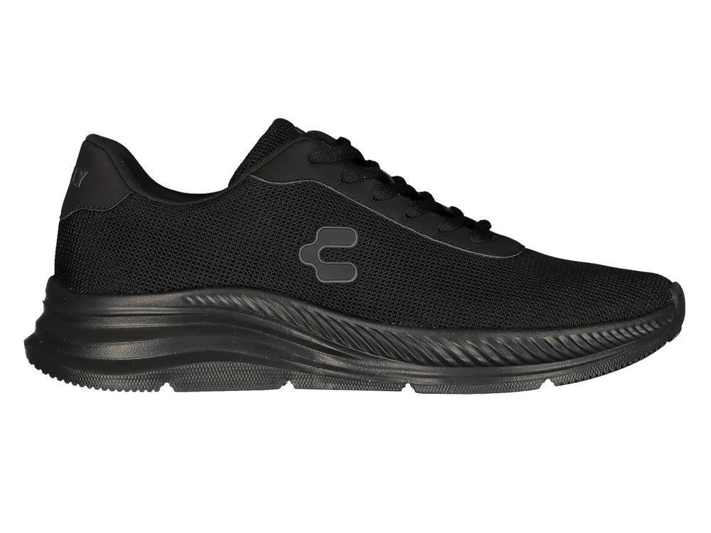 Par de tenis deportivos Charly color negro con malla transpirable y suela texturizada.