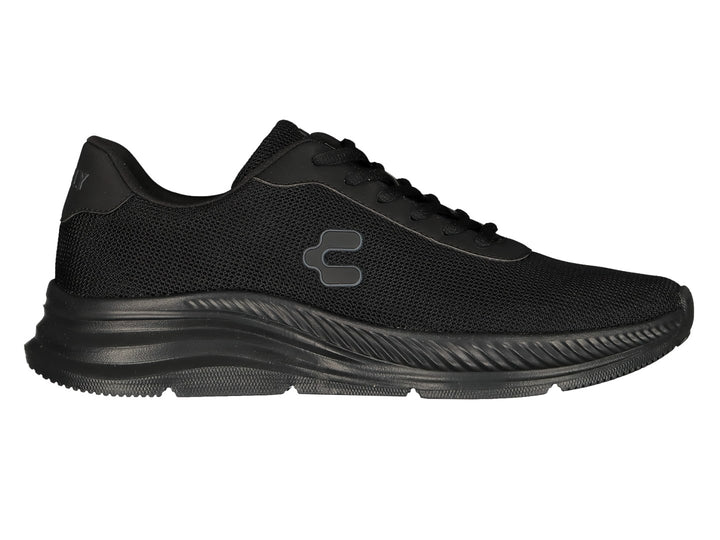 Par de tenis deportivos Charly color negro con malla transpirable y suela texturizada.