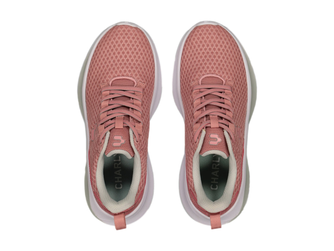 Tenis deportivos Charly color rosa con suela blanca y tejido de malla.