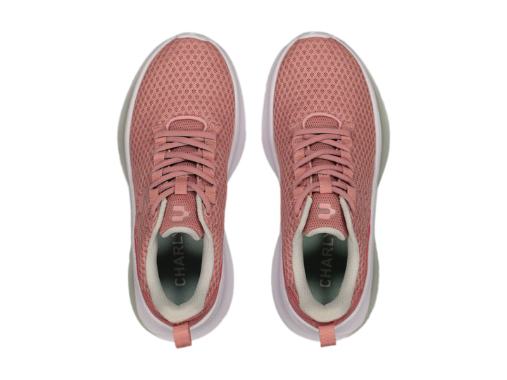 Tenis deportivos Charly color rosa con suela blanca y tejido de malla.