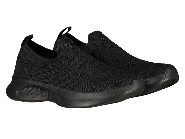 Par de tenis deportivos Charly color negro, estilo slip-on sin cordones con acabado en tela tejida.