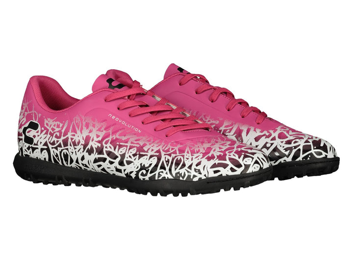Par de zapatos de fútbol Charly en color rosa con patrones blancos y suela negra.