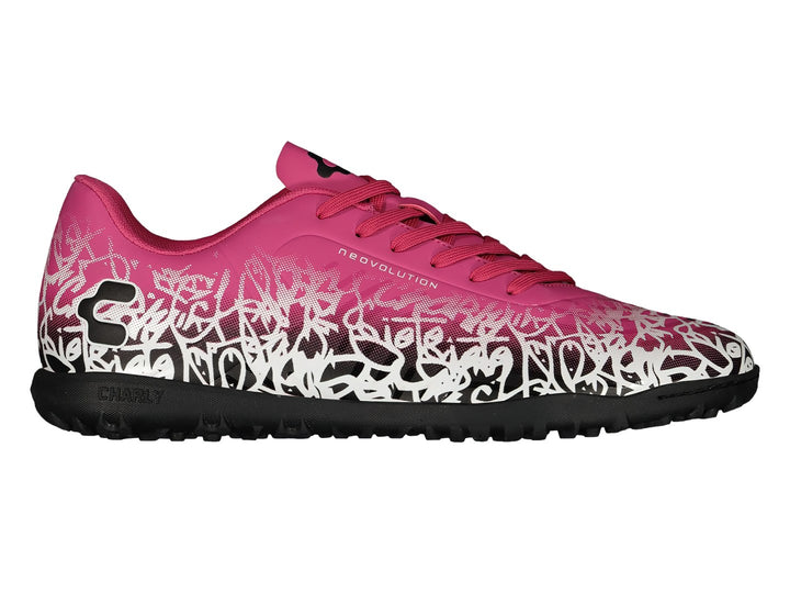 Par de zapatos de fútbol Charly en color rosa con patrones blancos y suela negra.